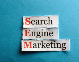 Search Engine Marketing paper cutout highlighting SEM in red for search engine marketing services.
