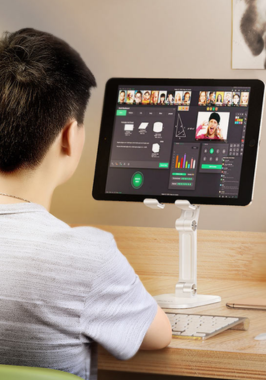 SEO-Friendly Website Video Production Agency in Coimbatore A person sitting at a desk with a computer and keyboard working on social media marketing videos.